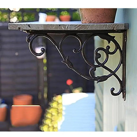 Hella Sturdy Rock Solid Cast Iron Wall Mounted Corner Support Brackets With A Killer Vintage Floral Design for a rustic shelf.