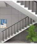 Heavy Duty Black Railing Balusters And Stair Spindles 25 Pack Wrought Iron Look Deck Post Kit installed on staircase.