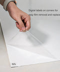 Person peeling back a layer of Heavy Duty 300 Sheet Adhesive Tacky Mats For Sweeping Dust Dirt And Grit Off Boots And Equipment Wheels.