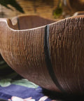 Close-up of Rustic Ceramic Vessel Sink And Faucet Combo Countertop Wash Basin Heavy Duty Hand Molded Artistic Funnel Design texture.