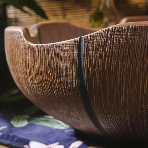 Close-up of Rustic Ceramic Vessel Sink And Faucet Combo Countertop Wash Basin Heavy Duty Hand Molded Artistic Funnel Design texture.