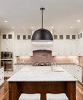 Warren 1 Light Pendant In Matte Black With White Interior Dome Shade hanging above kitchen island