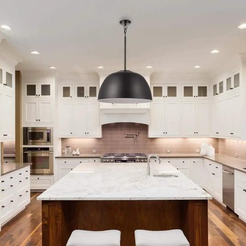 Warren 1 Light Pendant In Matte Black With White Interior Dome Shade hanging above kitchen island