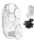 Grippy Wall Mount Hook With Heavy Duty Adhesive Strip No Stress Drilling Required holds a black loofah near a transparent wall mount on tile.