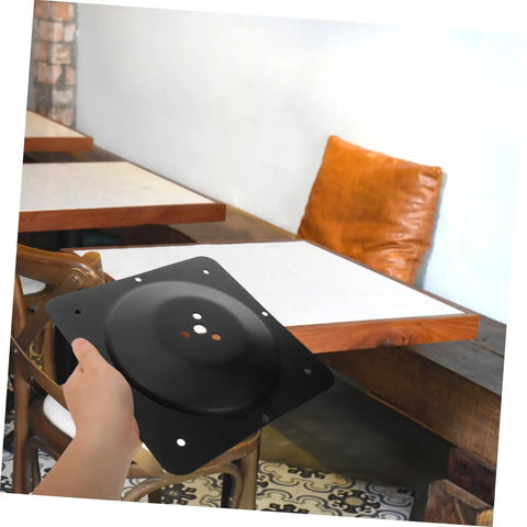 Heavy Duty Steel Table Leg Connectors To Kick The Wobble Out Of Wobbly Couches And Wooden Dining Tables Fast With No Sweat Install showing a hand holding a black support bracket.