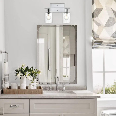 Bathroom setting with Chrome Finish 2 Light Industrial Indoor Wall Sconce For Bathroom Vanity With Clear Glass Shade Over Mirror Slick Metal Fixture Bulb Not Included Easy Install above a mirror.