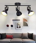 Flexible Ceiling Track Lighting Kit 4-Light Black Track Fixture with Adjustable Swing Arms in a living room setting.