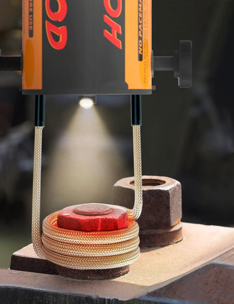 Solary magnetic induction heater coil with 7 coils; orange/black unit with beige braided cables over a metal workpiece