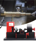 High Speed Mini Motorized Lathe Machine 20000Rpm 24W Compact Power Tool view with metal turning piece and red knobs.