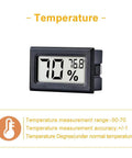 Mini Digital Temperature And Humidity Gauge With Built In Probe, Handy Compact Indoor Thermometer And Hygrometer With LCD Display In Fahrenheit, Ideal For Humidors, Greenhouses, Gardens, And Home Climates. black LCD display showing 70% and 76.8°F