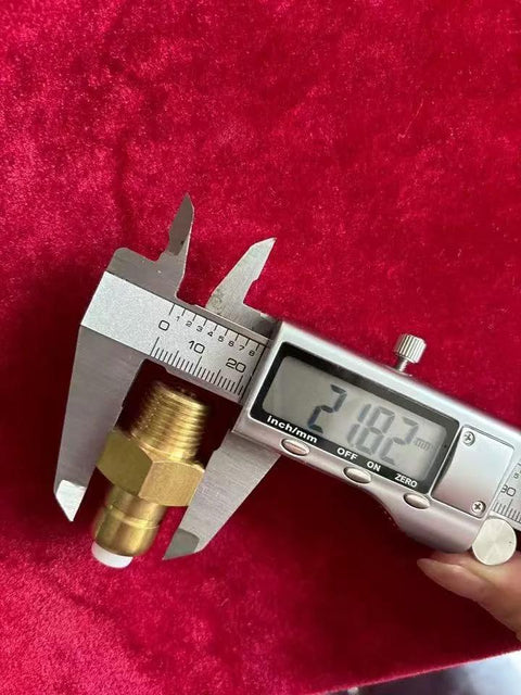 Brass 3/8-in NPT thermal relief valve for pressure washer pump, shown with a digital caliper.