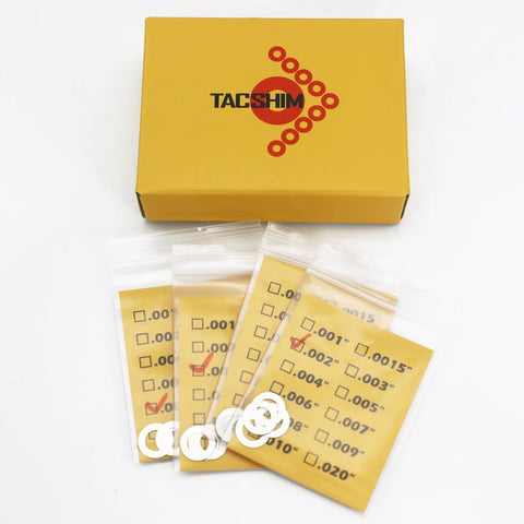 TACSHIM pivot pin and take-down shim kit, 0.276 in, 14-pack; metal shims in labeled bags, front view.