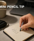 Person using Mini Pencil EDC Pendant With Infinite Keychain to write quick notes on a notepad, showcasing pocket-sized graphite tool.