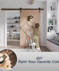 Child painting 48 Inch By 80 Inch Sliding Wood Barn Door With 8 Foot Hardware Kit Included, K Shape Solid Spruce Panel in room.