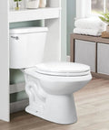 White elongated toilet seat with slow-close hinges installed in a modern bathroom, featuring non-slip bumpers and durable plastic.