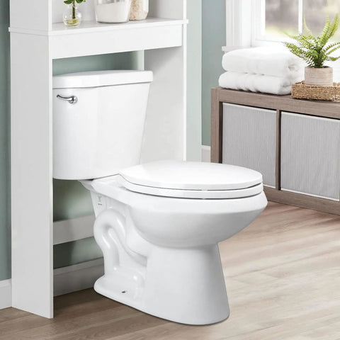 White elongated toilet seat with slow-close hinges installed in a modern bathroom, featuring non-slip bumpers and durable plastic.