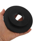 Hand holding a black plastic component for Wheel Balancer Guard Panel With Drive Belt Cover And Durable Housing Shield For Tire Balancing Equipment Fast Install Heavy Duty Protection For Busy Garages And Shops