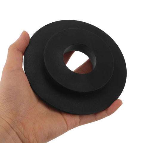 Hand holding a black plastic component for Wheel Balancer Guard Panel With Drive Belt Cover And Durable Housing Shield For Tire Balancing Equipment Fast Install Heavy Duty Protection For Busy Garages And Shops