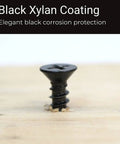 Close-up of a Black Xylan Coated Heavy Duty No 8 Wood Screw 1 Inch, partially installed in wood, showcasing corrosion resistance.