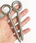 Close-up of two stainless steel eye screws from 4 Pack M8 Heavy Duty Swing Hooks Eye Screws 1200Lb Capacity Hammock Hanging Kit.