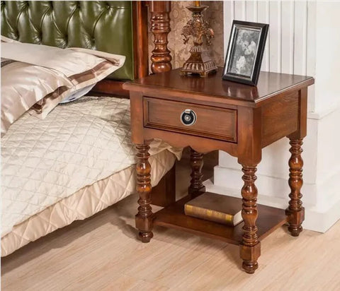 Bedside table with Six Piece Antique Brass Drawer Ring Pull Handle installed, showcasing classic vintage style in elegant retro floral design.