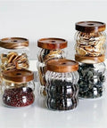 Premium Textured Glass Tea Canisters For Loose Leaf Coffee Beans And Pantry Essentials in various sizes with wooden lids.