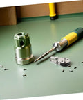 Tools on a bench with screws, unrelated to Beefy Stainless Steel Sailing Pulley Block Set 4 Pack For Marine Rigging And Kayak Gear Rugged Pulleys With Smooth Bearings Ready To Replace Cable Wheels For Anchors Masts And Tackle.
