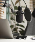 Rock Solid Microphone Stand Thumb Screws Decked Out With Tee Wing Knobs and Heavy Duty Clamping Hardware For Studio Sessions Stage Builds And Live Gig Gear Easy Hand Tighten Grab Includes Ten Pieces with a microphone and laptop.