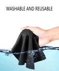 Hand holding Ultra Soft Extra Large Microfiber Cleaning Cloth submerged in water, emphasizing washable and reusable feature.