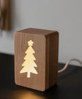 Top Shelf Christmas Acrylic Router Templates With Slick Holiday Motifs For Knockout Diy Woodworking And Cabinet Jigs Measuring Five Point Five By Seven Point Nine Inches In Crisp White Finish on a wooden light decor.