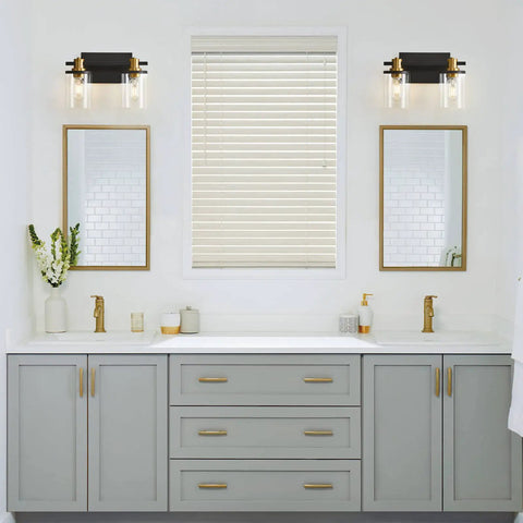 2 Light Vanity Light Fixture Black and Gold With Clear Glass Shade Matte Black Finish Brushed Gold Copper Accent Socket in bathroom.