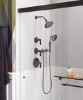 Bathroom setup featuring Bancroft Wall-Mount Handshower Holder, Solid Brass Construction, Adjustable Pivot Bracket in oil-rubbed bronze finish.