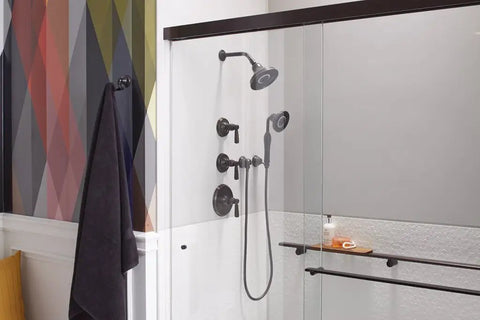 Bathroom setup featuring Bancroft Wall-Mount Handshower Holder, Solid Brass Construction, Adjustable Pivot Bracket in oil-rubbed bronze finish.