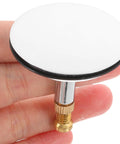 Adjustable Bathtub Drain Plug Silver Copper with Rotary Mechanism held in hand, featuring a round white top and brass mechanism.