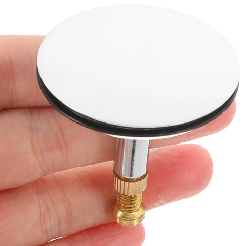 Adjustable Bathtub Drain Plug Silver Copper with Rotary Mechanism held in hand, featuring a round white top and brass mechanism.