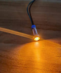 Orange LED Indicator Lights 3V To 9V DC Waterproof Panel Mount Signal Lamp Kit 5 Pack emitting light, showcasing anti shock features