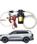 Must-Have 12V Self-Priming Oil Transfer Pump For Fast Fluid Extraction From Cars Trucks Boats And Lawn Mowers In Your Garage Or Shop During Any Weekend Project with attached wires and tubing.