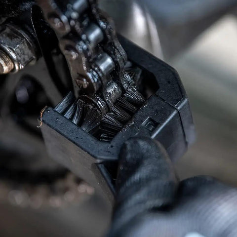 Close-up of Motorcycle Chain Cleaning Brush With Multi Sided Head Cleans Three Sides Of The Chain At Once during use