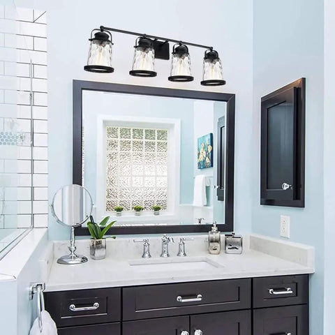 Four Light Farmhouse Vanity Lights With Rustic Wall Sconces And Hammered Glass Shades over bathroom mirror with black frame.