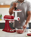 Person using Stand Mixer Food Grinder Attachment for KitchenAid Style Mixers, Coarse and Fine Grinding Settings, Perfect for Ground Meat.