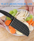 Front view of black handheld stainless steel crinkle potato cutter with wavy blade