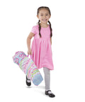 Child carrying Cutie Pie Butterfly Foldable Kids Chair For Lawn And Camping in striped carry bag, easy to transport for playtime.