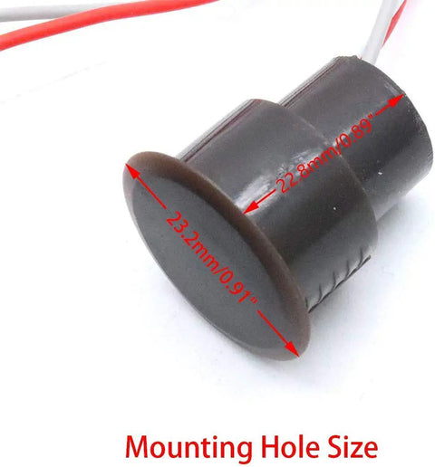 Close-up of a recessed window and door contact sensor with mounting hole size, part of a home security kit with magnetic reed switch.