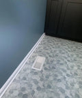Walk-On Ready Floor Register Vent For 4x10 Openings, Heavy Duty White Finish installed in decorative tile floor near kitchen cabinet