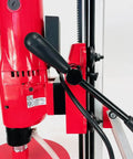 Close-up of the Straight Shooting Heavy Duty Workhorse Diamond Coring Drill handle and motor, showcasing red finish and controls.