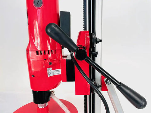Close-up of the Straight Shooting Heavy Duty Workhorse Diamond Coring Drill handle and motor, showcasing red finish and controls.