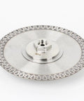 Heavy Duty Quick Change Adapter Links Threaded Blades Directly For Rock Solid Grinding Cutting And Core Drilling Built Badass With Hella Durable Steel Super Smooth Shop Performance On Any Power Tool Project, 7-inch steel blade with M14 fitting.