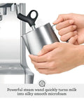 Person using steam wand on Smart Home Espresso Maker For Barista Level Espresso At Home With Programmable Brew Custom Strength Quick Heat And Compact Black Sesame Design That Fits Small Kitchens And Tiny Countertops