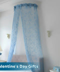 Rod pocket curtains in light blue draping over a metal bed canopy frame, suitable for any bedroom setup.