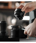 Hella Smooth Espresso Bed Leveler Cyclone Coffee Distributor Spinner for 51 58 mm portafilters being used to distribute coffee grounds.